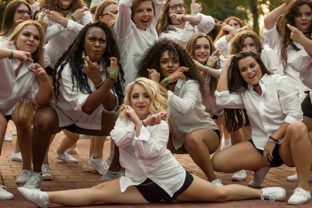 A group of female students posing together during Shirttails.