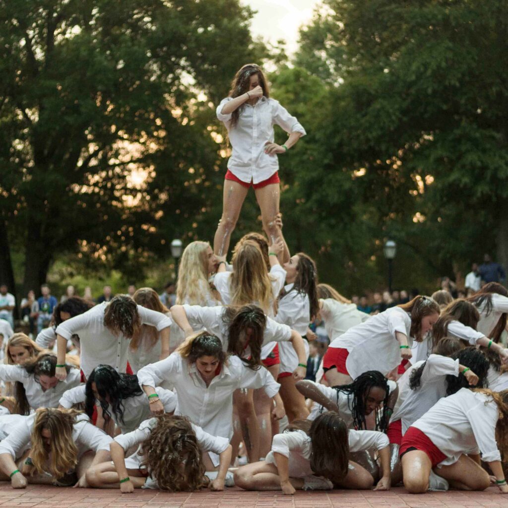 A group of female students in a Shirttails performance.