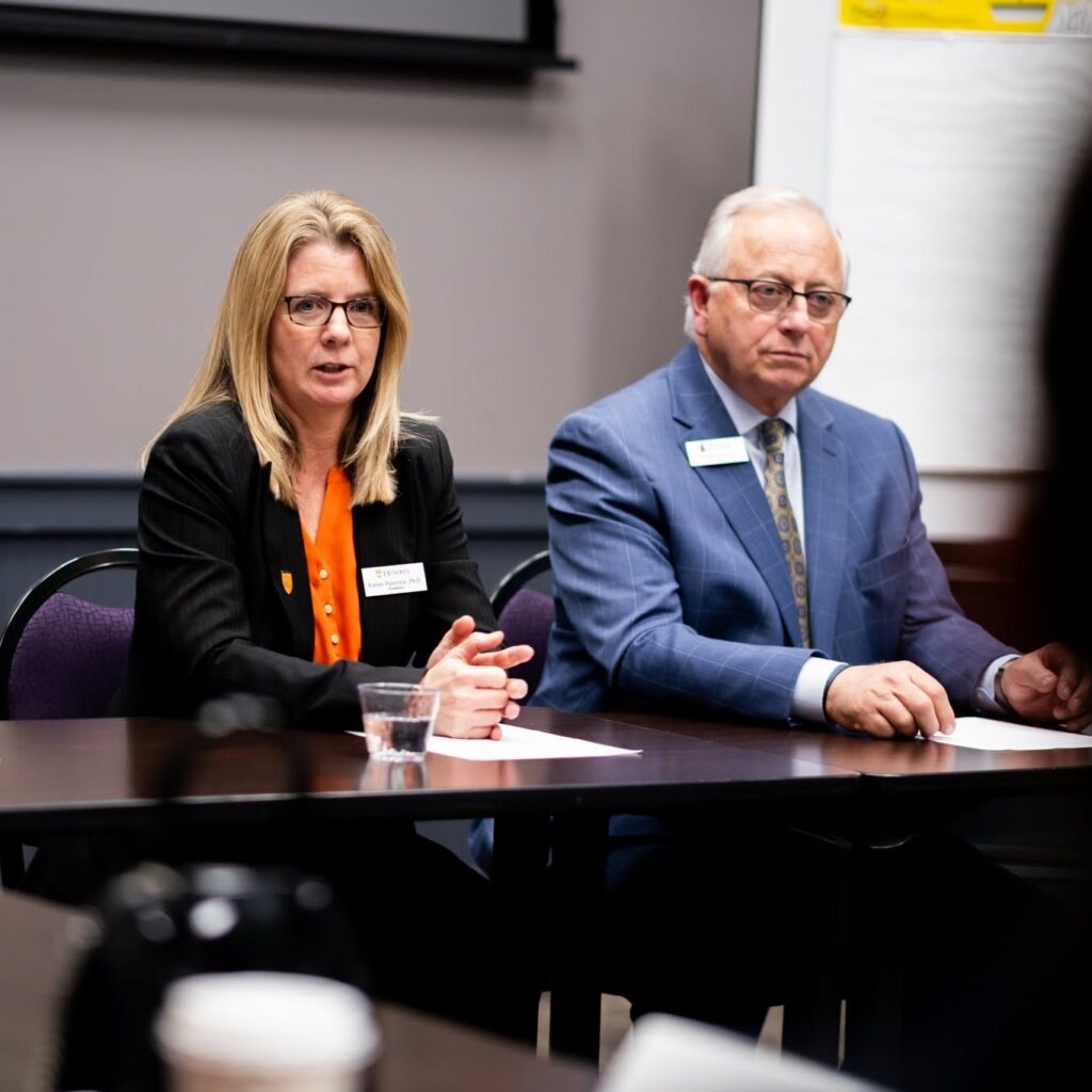 President Petersen speaks at a meeting.