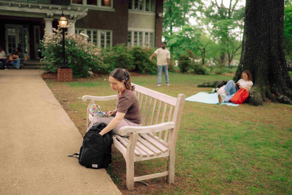 Students engaged in individual activities on campus.