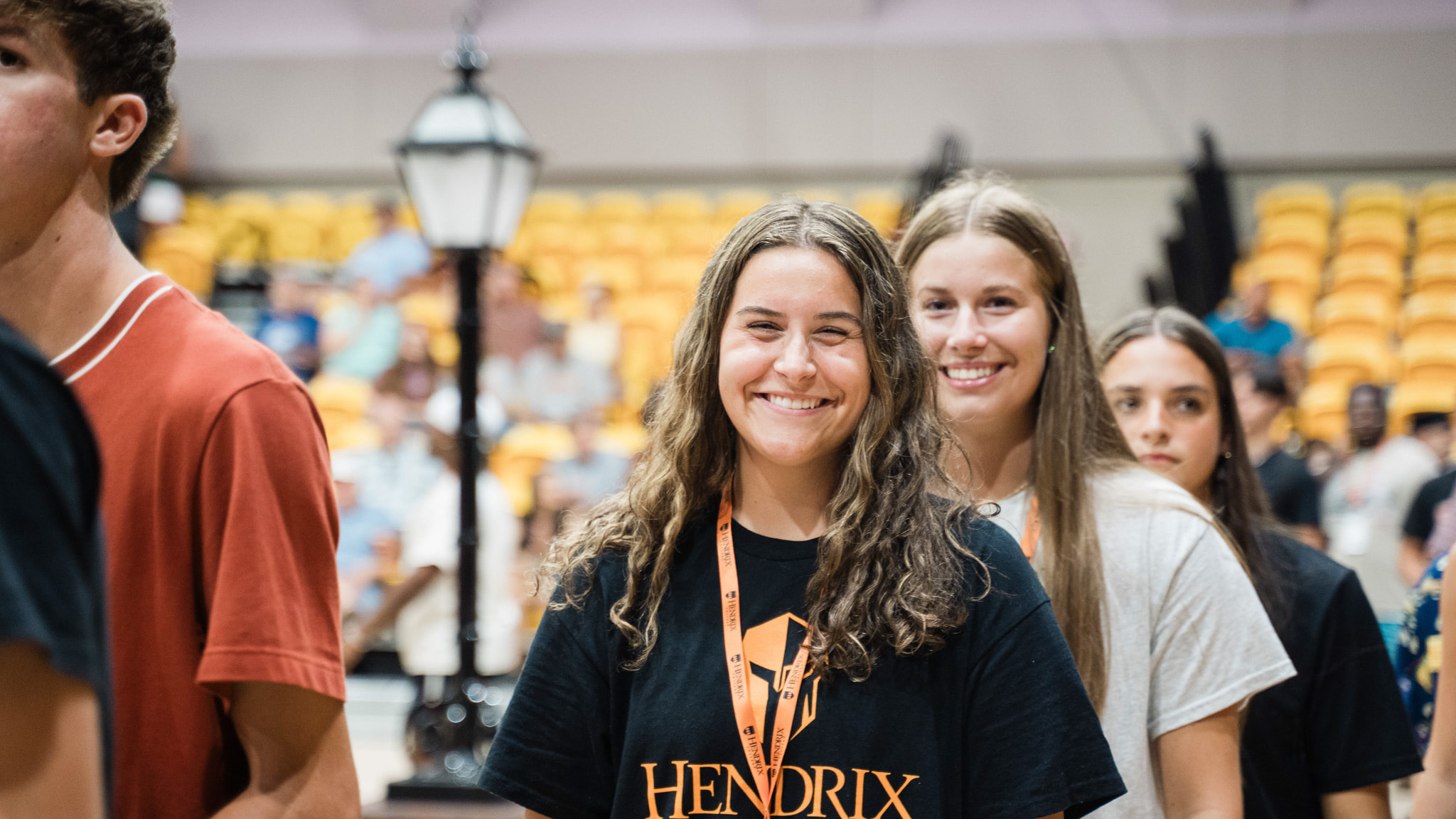 A line of 4 people stand in line on Hendrix’s move-in day. One person smiles at the camera.