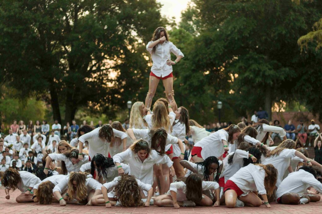 Students stack themselves in a pyramid during Veasey Hall’s Shirttails dance.
