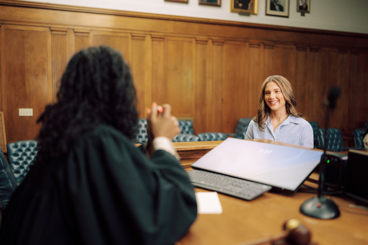 A student speaks with a judge.