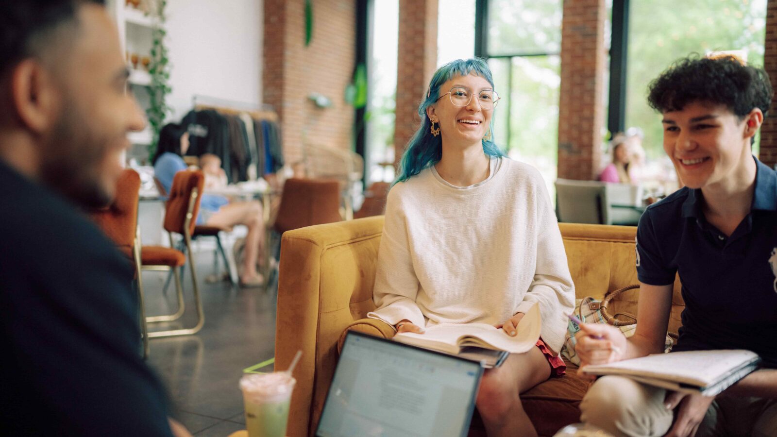 Students gather at a coffee shop to study.