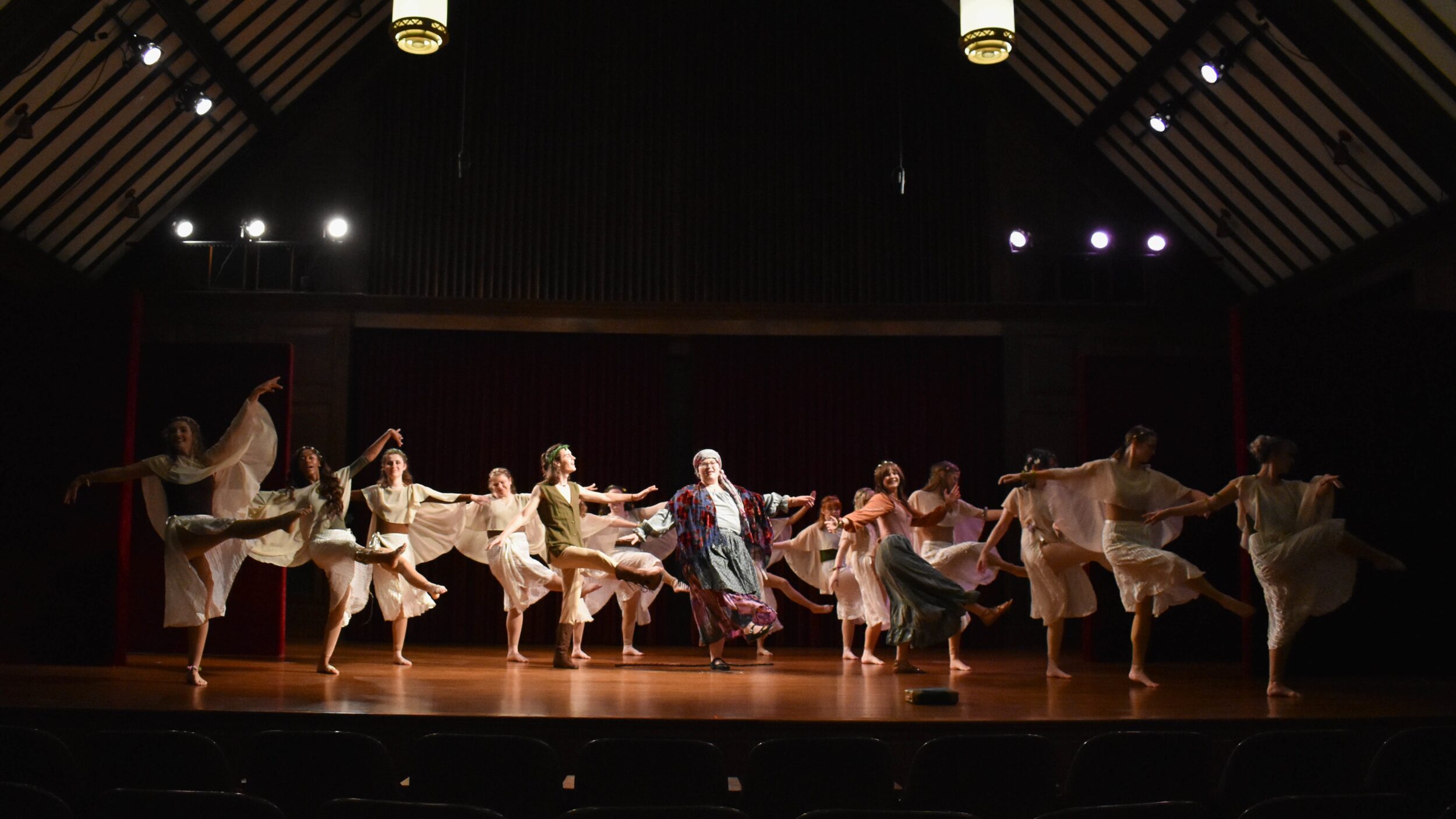 15 dancers perform on stage